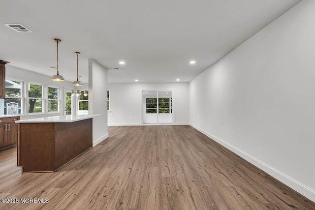 85 Central Blvd, Brick, NJ 08724 - unfurnished living room featuring wood finished floors, baseboards, plenty of natural light, and recessed lighting