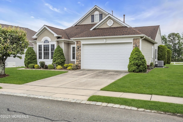 46 Pancoast Rd, Waretown, NJ 08758 - traditional-style home with stone siding, central AC unit, an attached garage, a shingled roof, and a front yard