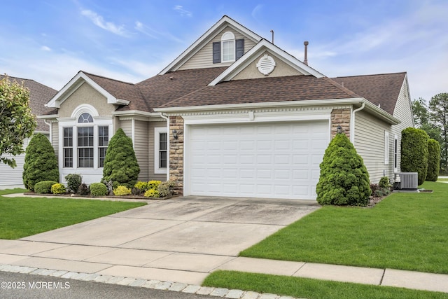 46 Pancoast Rd, Waretown, NJ 08758 - view of front of house featuring cooling unit, an attached garage, roof with shingles, and driveway