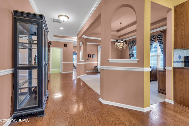 46 Pancoast Rd, Waretown, NJ 08758 - corridor featuring a chandelier, wood finished floors, baseboards, ornamental molding, and a tray ceiling