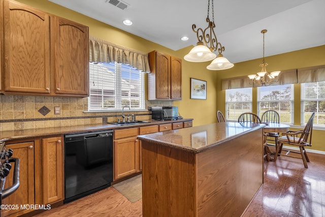 46 Pancoast Rd, Waretown, NJ 08758 - kitchen with black appliances, a sink, light wood finished floors, plenty of natural light, and recessed lighting