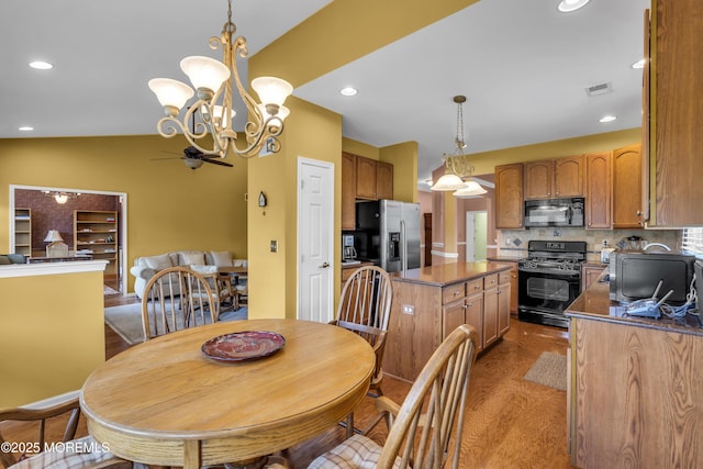 46 Pancoast Rd, Waretown, NJ 08758 - dining room with a chandelier, dark wood-style flooring, recessed lighting, and lofted ceiling