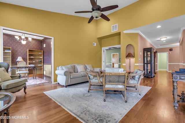 46 Pancoast Rd, Waretown, NJ 08758 - dining space with baseboards, a chandelier, ceiling fan, wallpapered walls, and wood finished floors