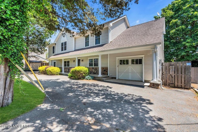 85 Main Bayway, Toms River, NJ 08753 - view of front of house with covered porch, a garage, asphalt driveway, and roof with shingles