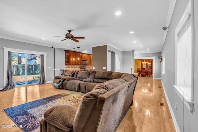 85 Main Bayway, Toms River, NJ 08753 - living room with a ceiling fan, recessed lighting, light wood-style flooring, crown molding, and baseboards