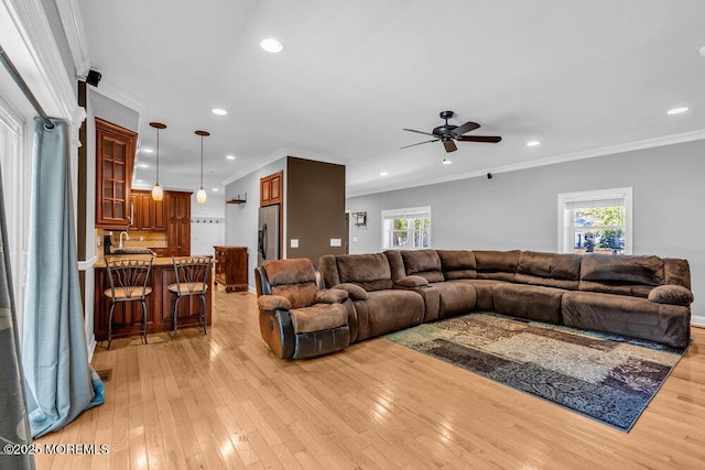 85 Main Bayway, Toms River, NJ 08753 - living area with light wood-type flooring, ceiling fan, plenty of natural light, recessed lighting, and ornamental molding