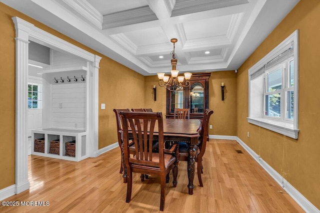 85 Main Bayway, Toms River, NJ 08753 - dining room featuring a chandelier, coffered ceiling, light wood-type flooring, crown molding, and baseboards