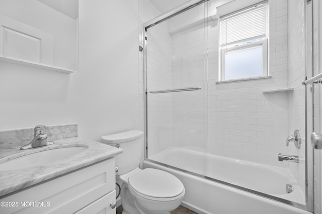 803 Ocean Ave Unit 7, Bradley Beach, NJ 07720 - bathroom featuring vanity, combined bath / shower with glass door, and toilet