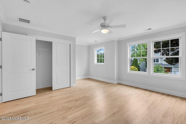 909 Leighton Ave, Point Pleasant, NJ 08742 - unfurnished bedroom with baseboards, light wood-style flooring, crown molding, a closet, and ceiling fan