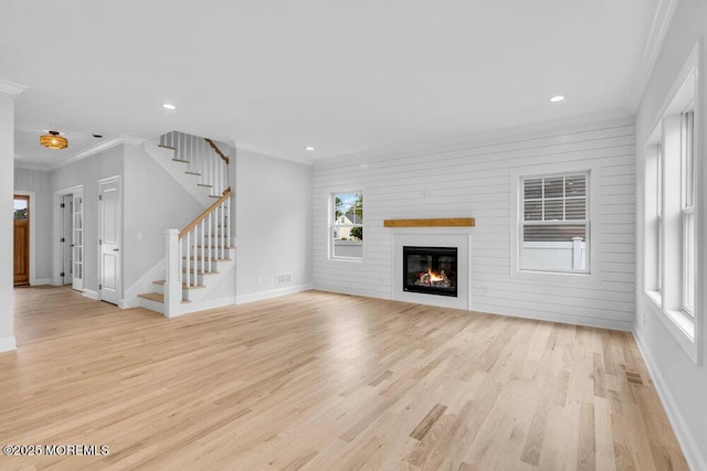 909 Leighton Ave, Point Pleasant, NJ 08742 - unfurnished living room featuring light wood-style floors, healthy amount of natural light, baseboards, recessed lighting, and ornamental molding