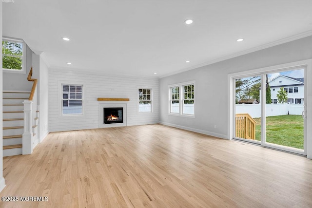 909 Leighton Ave, Point Pleasant, NJ 08742 - unfurnished living room with crown molding, light wood-type flooring, baseboards, stairway, and recessed lighting