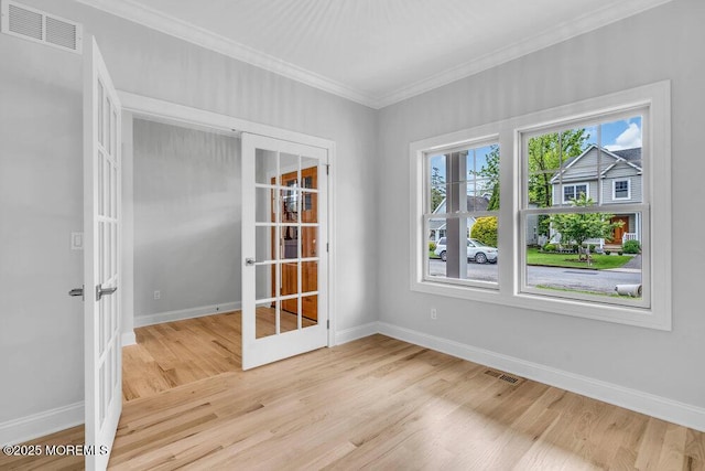 909 Leighton Ave, Point Pleasant, NJ 08742 - empty room featuring crown molding, light wood finished floors, baseboards, and french doors