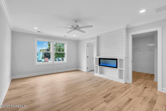 909 Leighton Ave, Point Pleasant, NJ 08742 - unfurnished living room featuring ornamental molding, baseboards, light wood-style flooring, a ceiling fan, and a fireplace