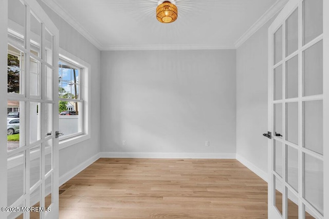 909 Leighton Ave, Point Pleasant, NJ 08742 - spare room with french doors, light wood-style flooring, baseboards, and ornamental molding