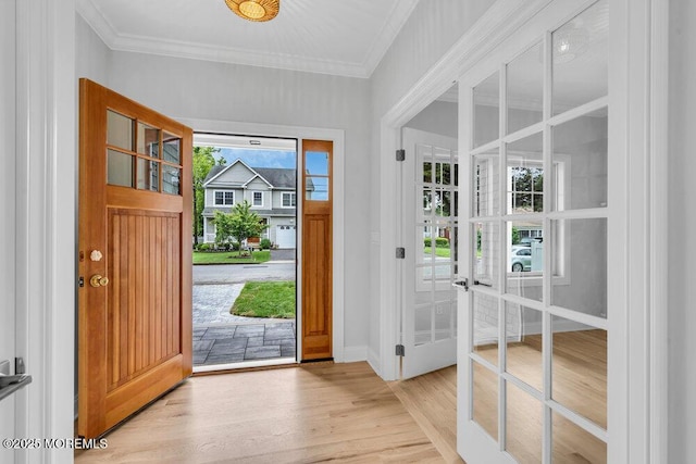 909 Leighton Ave, Point Pleasant, NJ 08742 - foyer featuring light wood finished floors, ornamental molding, baseboards, and french doors