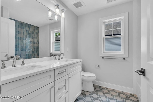 909 Leighton Ave, Point Pleasant, NJ 08742 - full bathroom featuring double vanity, toilet, a shower, baseboards, and tile patterned floors