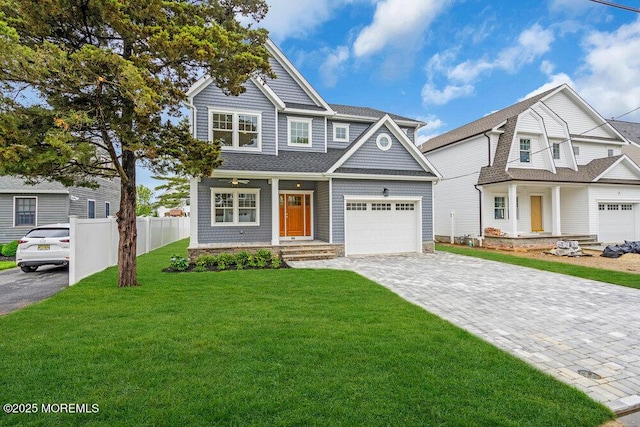 909 Leighton Ave, Point Pleasant, NJ 08742 - view of front of property with a porch, decorative driveway, roof with shingles, and an attached garage