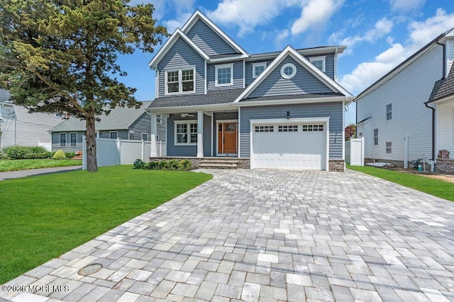 909 Leighton Ave, Point Pleasant, NJ 08742 - view of front of property featuring decorative driveway, a garage, and covered porch