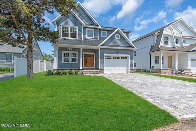 909 Leighton Ave, Point Pleasant, NJ 08742 - view of front facade featuring a porch, decorative driveway, and a garage