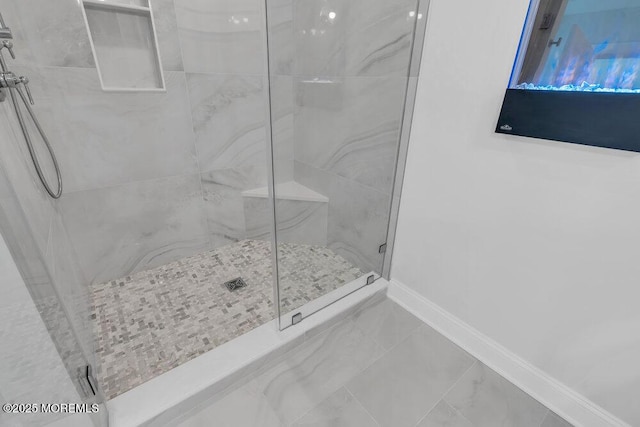 909 Leighton Ave, Point Pleasant, NJ 08742 - bathroom with a marble finish shower, baseboards, and marble finish floors