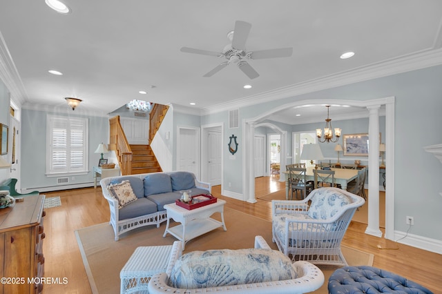 842 E Ave, Bay Head, NJ 08742 - living room with stairs, ceiling fan, arched walkways, ornamental molding, and wood finished floors