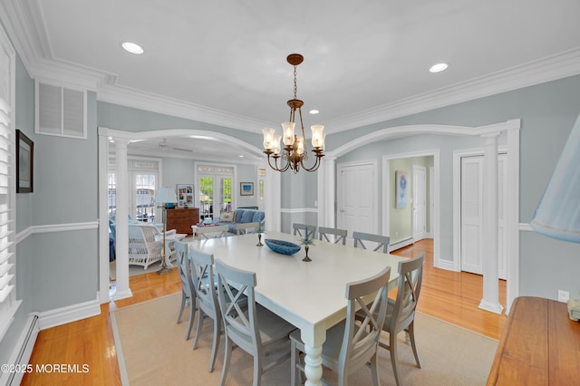842 E Ave, Bay Head, NJ 08742 - dining space with decorative columns, arched walkways, a baseboard heating unit, crown molding, and light wood-type flooring