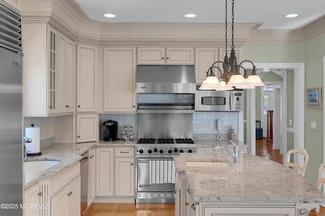 842 E Ave, Bay Head, NJ 08742 - kitchen featuring premium appliances, a sink, ornamental molding, a chandelier, and pendant lighting