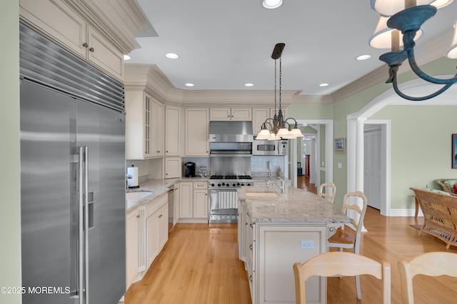 842 E Ave, Bay Head, NJ 08742 - kitchen with premium appliances, backsplash, a sink, light stone counters, and recessed lighting