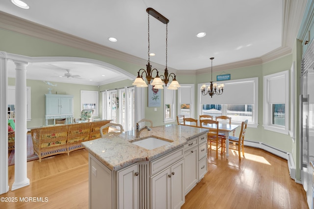 842 E Ave, Bay Head, NJ 08742 - kitchen featuring a sink, a ceiling fan, hanging light fixtures, light wood finished floors, and plenty of natural light