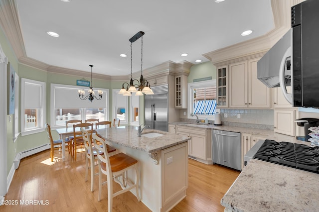 842 E Ave, Bay Head, NJ 08742 - kitchen featuring stainless steel appliances, a sink, a chandelier, glass insert cabinets, and recessed lighting