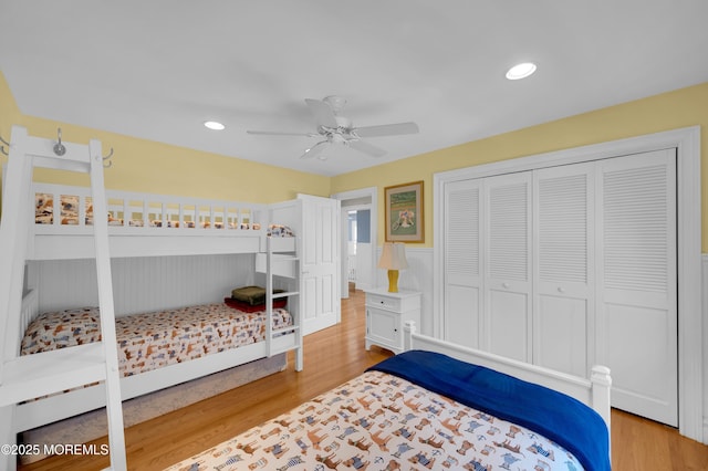 842 E Ave, Bay Head, NJ 08742 - bedroom featuring wood finished floors, wainscoting, a closet, a ceiling fan, and recessed lighting