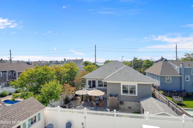 842 E Ave, Bay Head, NJ 08742 - back of property with a fenced backyard, a shingled roof, a patio, outdoor dining area, and a residential view