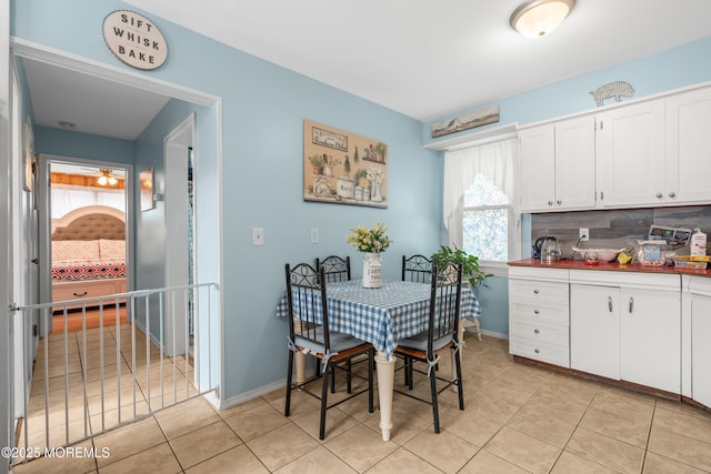 175 W Shore Ave, Bogota, NJ 07603 - dining area featuring light tile patterned floors and baseboards
