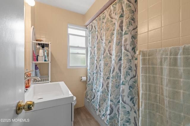 175 W Shore Ave, Bogota, NJ 07603 - bathroom featuring vanity, tile walls, wood finished floors, and a shower with curtain