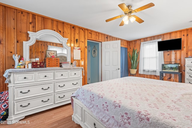 175 W Shore Ave, Bogota, NJ 07603 - bedroom featuring wood walls and light wood-type flooring