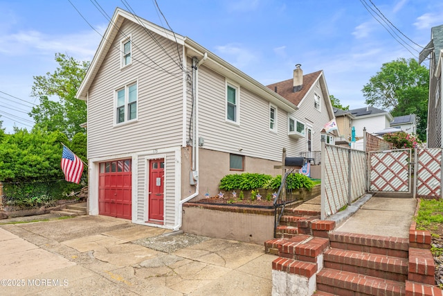 175 W Shore Ave, Bogota, NJ 07603 - view of property exterior featuring concrete driveway and an attached garage