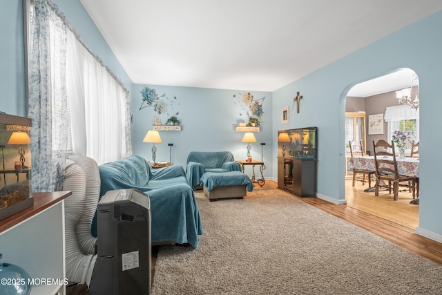 175 W Shore Ave, Bogota, NJ 07603 - living area with wood finished floors, arched walkways, and baseboards
