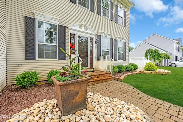 104 Plumstead Dr, Freehold, NJ 07728 - doorway to property with a lawn
