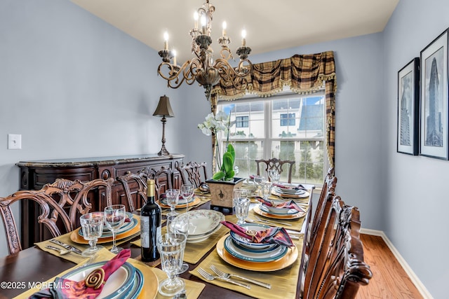 104 Plumstead Dr, Freehold, NJ 07728 - dining room with a chandelier, wood finished floors, and baseboards