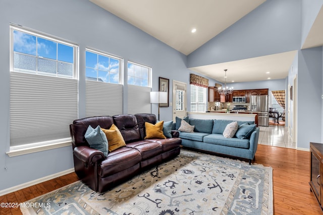 104 Plumstead Dr, Freehold, NJ 07728 - living area featuring a chandelier, baseboards, light wood-style floors, high vaulted ceiling, and recessed lighting