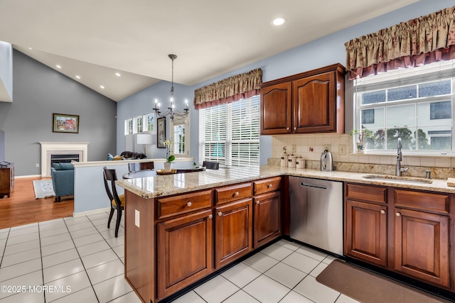 104 Plumstead Dr, Freehold, NJ 07728 - kitchen with stainless steel dishwasher, a sink, a peninsula, a chandelier, and plenty of natural light