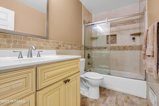 104 Plumstead Dr, Freehold, NJ 07728 - bathroom with toilet, vanity, combined bath / shower with glass door, and tile walls