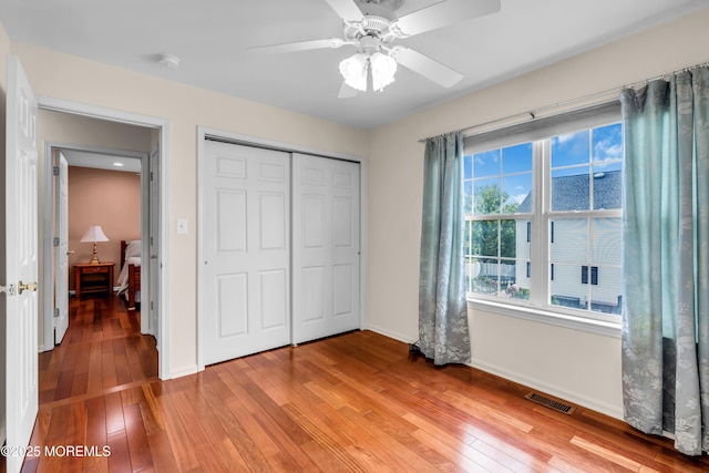 104 Plumstead Dr, Freehold, NJ 07728 - unfurnished bedroom with a closet, light wood-type flooring, baseboards, and ceiling fan
