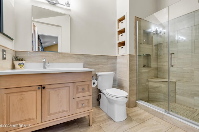 104 Plumstead Dr, Freehold, NJ 07728 - bathroom with toilet, vanity, a shower stall, tile walls, and tile patterned floors