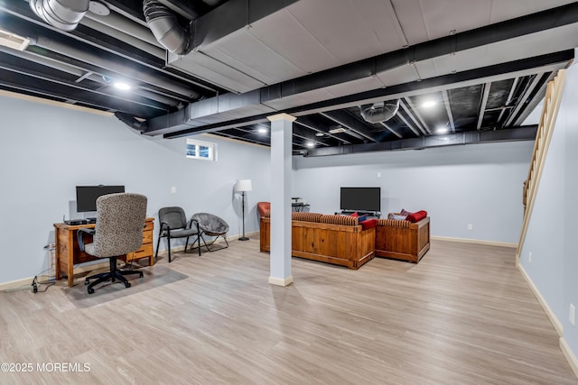 104 Plumstead Dr, Freehold, NJ 07728 - below grade area with wood finished floors, baseboards, and a desk