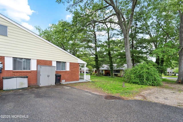 9D Dove St, Manchester, NJ 08759 - view of home's exterior featuring brick siding