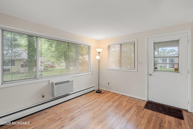 9D Dove St, Manchester, NJ 08759 - entryway featuring a baseboard radiator, light wood-type flooring, and baseboards