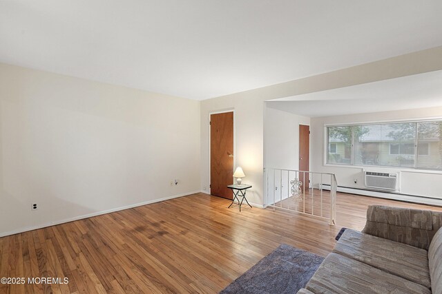 9D Dove St, Manchester, NJ 08759 - living room with wood finished floors, baseboard heating, and baseboards