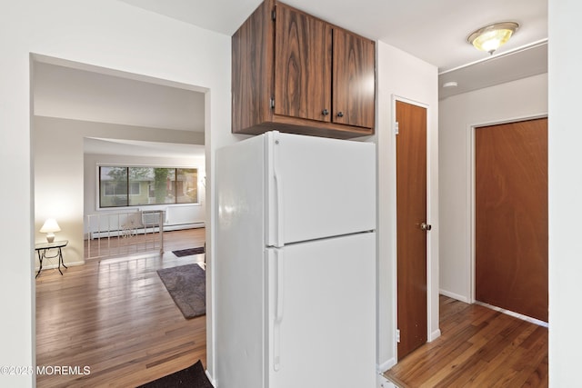9D Dove St, Manchester, NJ 08759 - kitchen featuring freestanding refrigerator, wood finished floors, baseboards, and a baseboard radiator