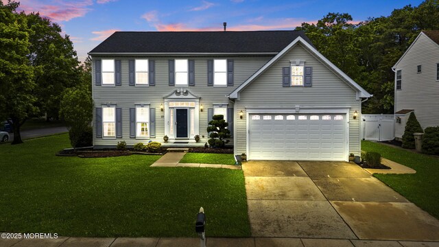 10 Butternut Ln, Bayville, NJ 08721 - colonial home featuring an attached garage and concrete driveway